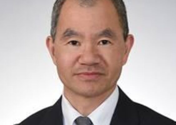 A headshot of Dr. Ming R. Wang.