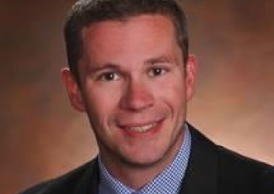 A headshot of Tim Muir.