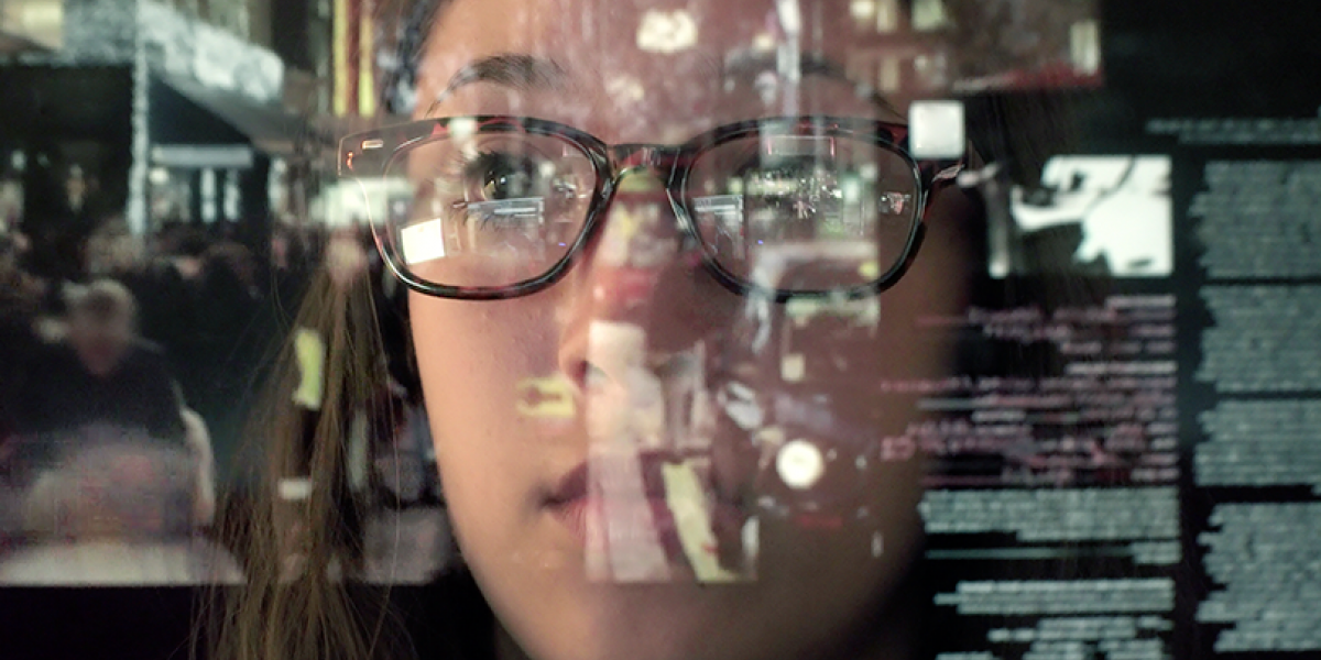 Close up of woman's face, looking thoughtful, with an image of text overlaid.