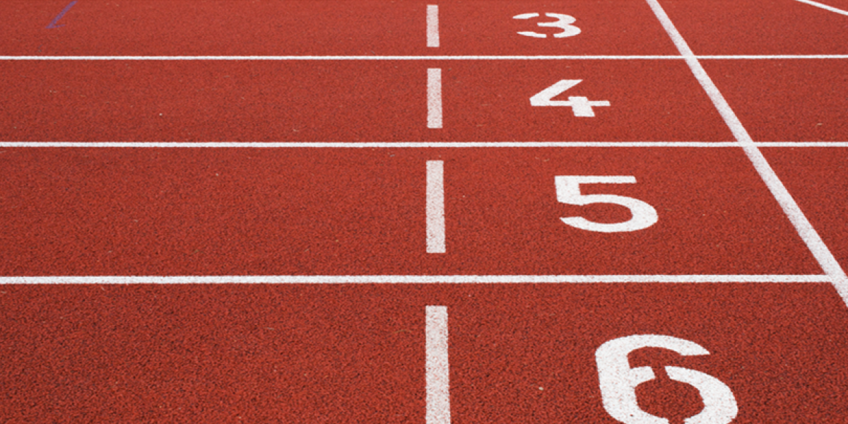 Close up of numbered lanes on an outdoor track.