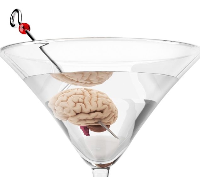 Close up of a martini with a brain replacing the olive.