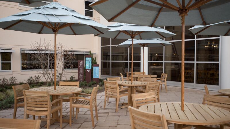 Outdoor dining area with tables and chairs