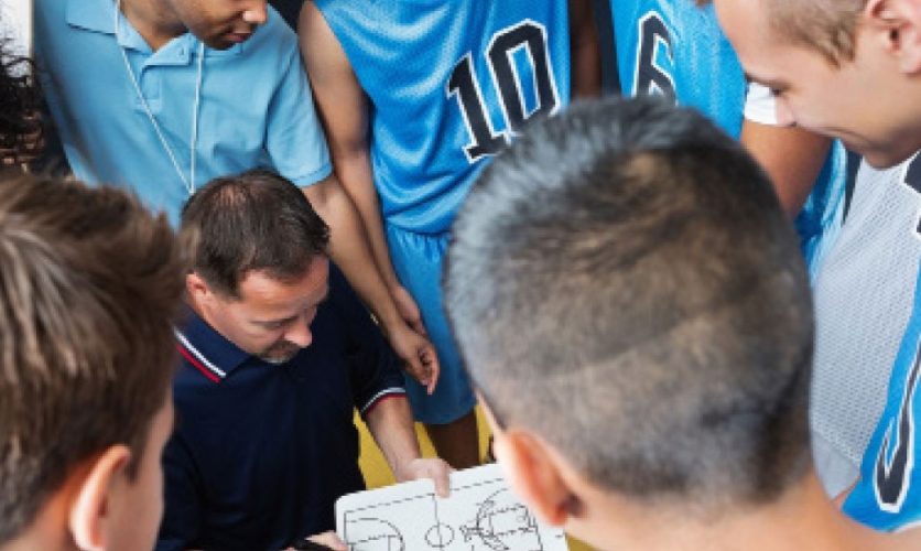 basketball players in huddle