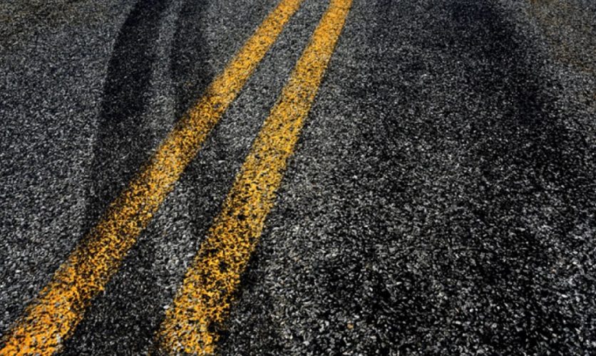 Skid marks crossing the center line of a road