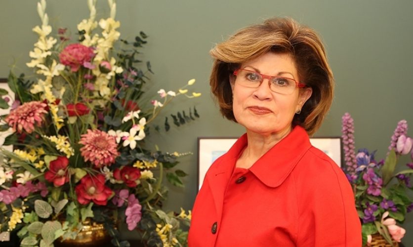 A photo of the author in a red coat.